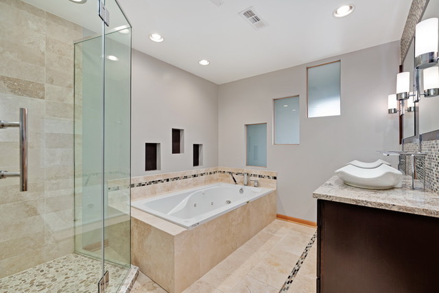 8013 West Irving Park Road Chicago, IL 60634 - Photo 14 of 25 a bathroom with a tub sink and mirror