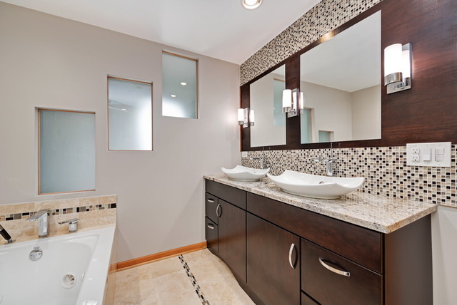 8013 West Irving Park Road Chicago, IL 60634 - Photo 15 of 25 a bathroom with a granite countertop sink and a mirror