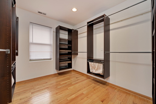 8013 West Irving Park Road Chicago, IL 60634 - Photo 16 of 25 a view of an empty room with a window and wooden floor