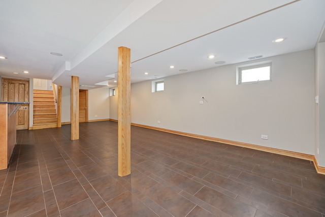 8013 West Irving Park Road Chicago, IL 60634 - Photo 19 of 25 a view of a hall with a ceiling fan