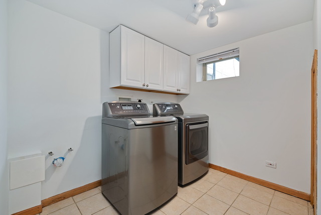 8013 West Irving Park Road Chicago, IL 60634 - Photo 23 of 25 a utility room with cabinets