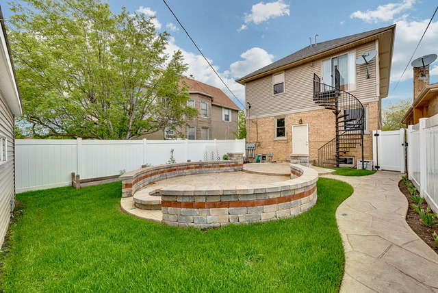 8013 West Irving Park Road Chicago, IL 60634 - Photo 25 of 25 a swimming pool with outdoor seating and yard