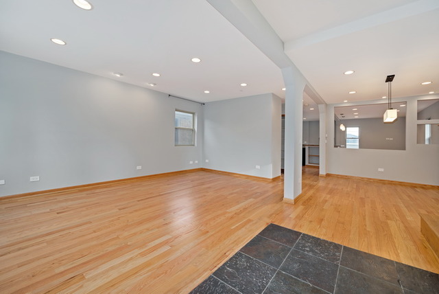 8013 West Irving Park Road Chicago, IL 60634 - Photo 3 of 25 a view of an empty room with wooden floor