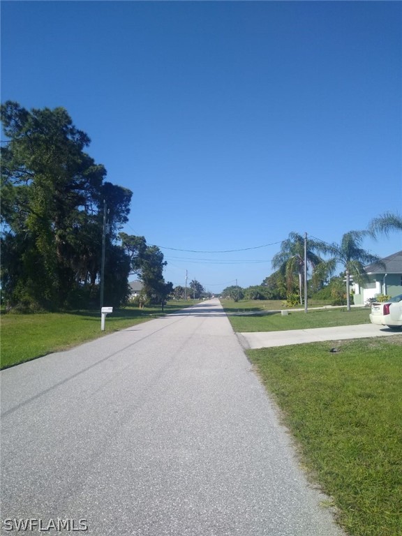 232 Tournament Road Rotonda West, FL 33947 - Photo 2 of 4 a view of a golf course with a lake