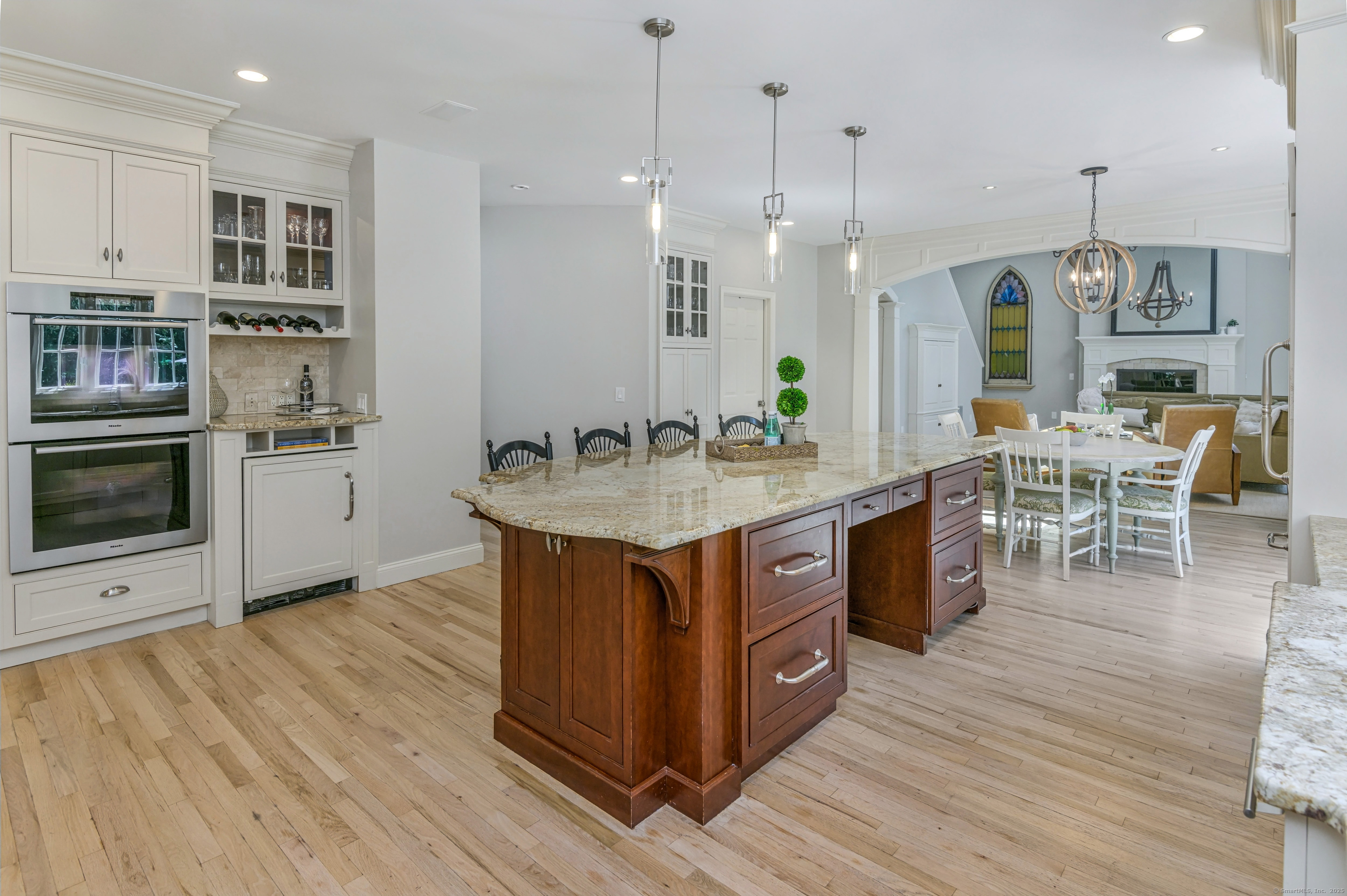 21 Schoolhouse Place Ridgefield, CT 06877 - Photo 12 of 40 a kitchen with stainless steel appliances granite countertop a wooden cabinets a stove a sink and a wooden floors