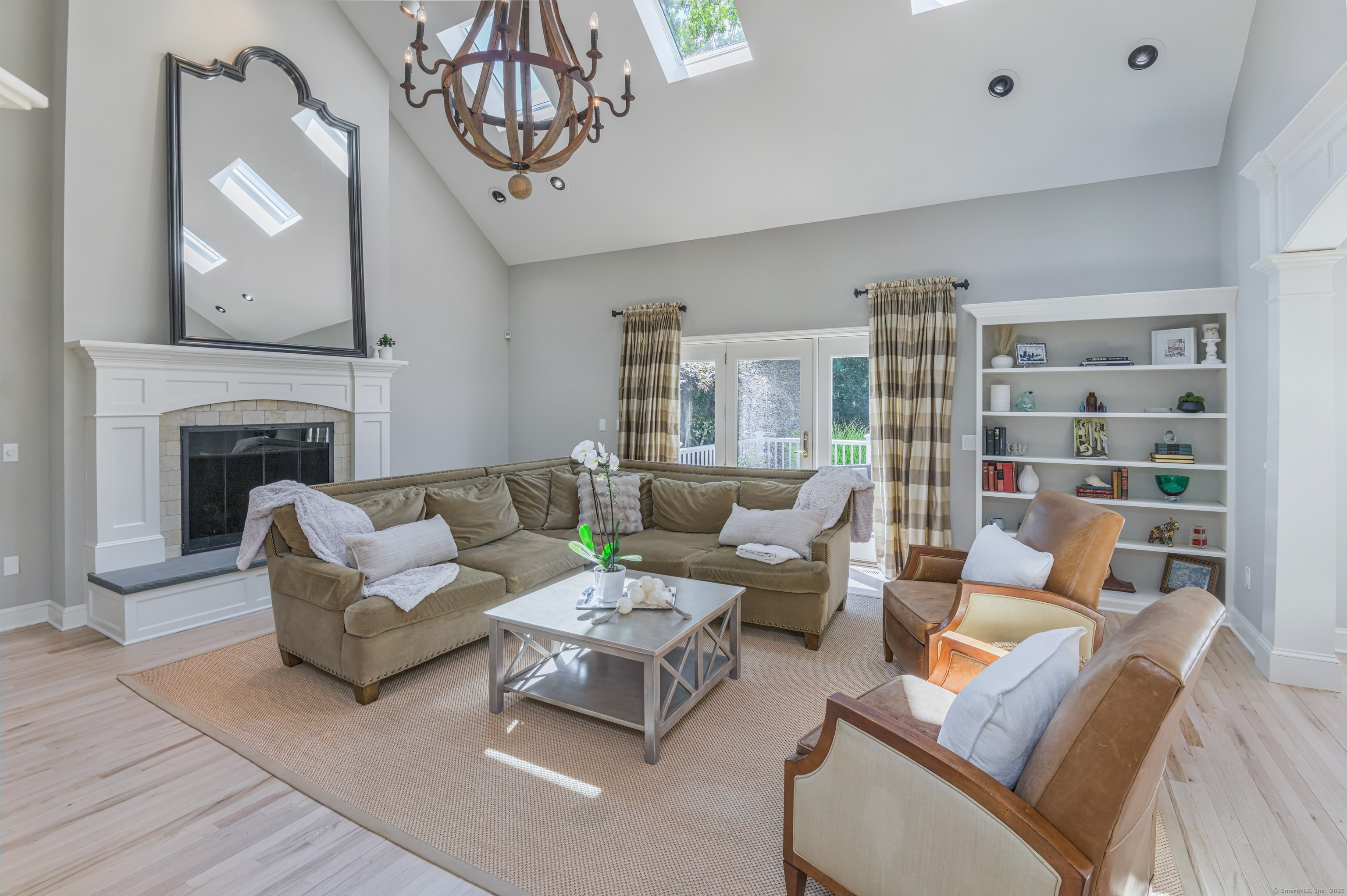 21 Schoolhouse Place Ridgefield, CT 06877 - Photo 13 of 40 a living room with furniture and a fireplace