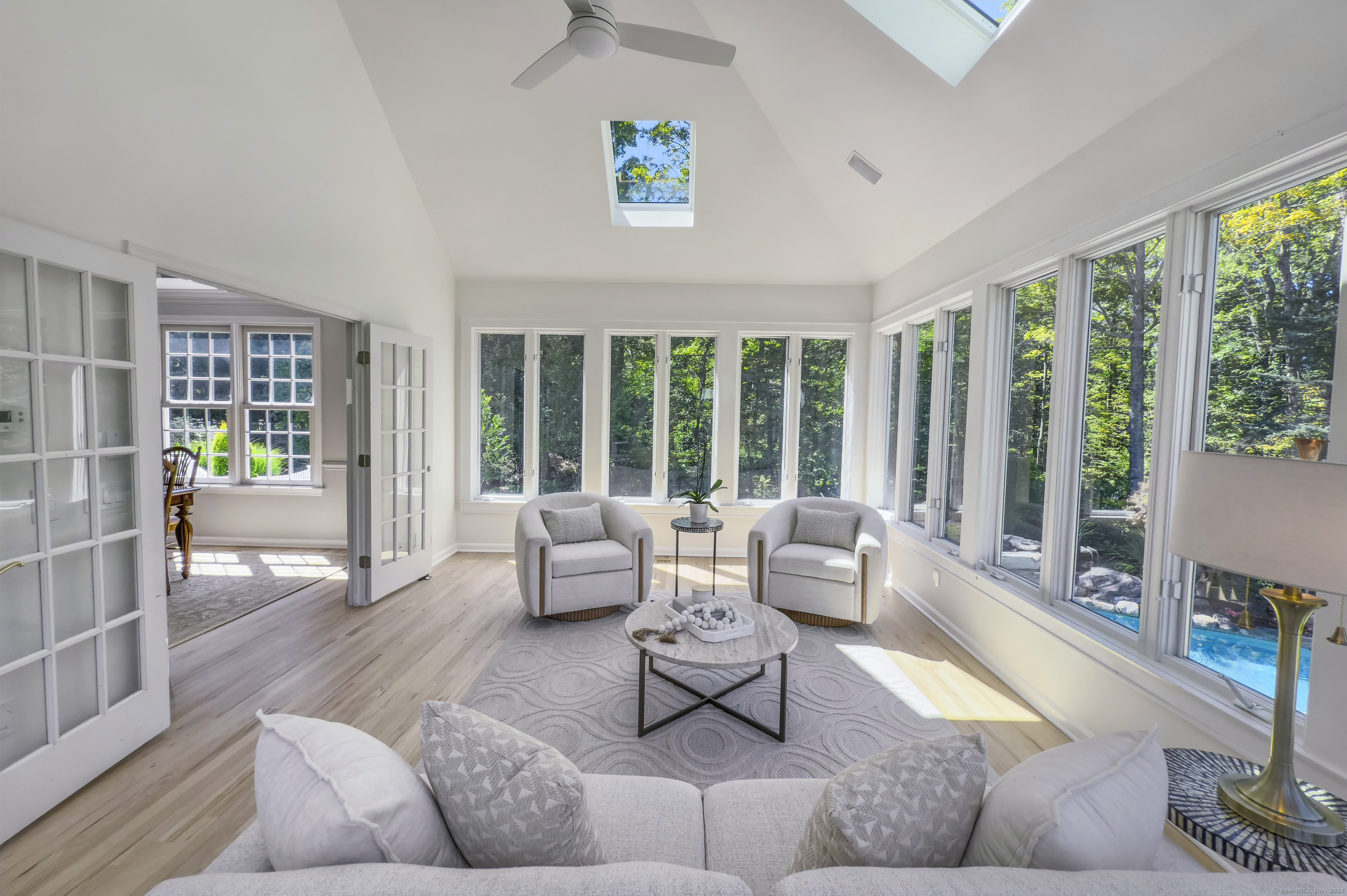 21 Schoolhouse Place Ridgefield, CT 06877 - Photo 16 of 40 a living room with furniture and floor to ceiling windows
