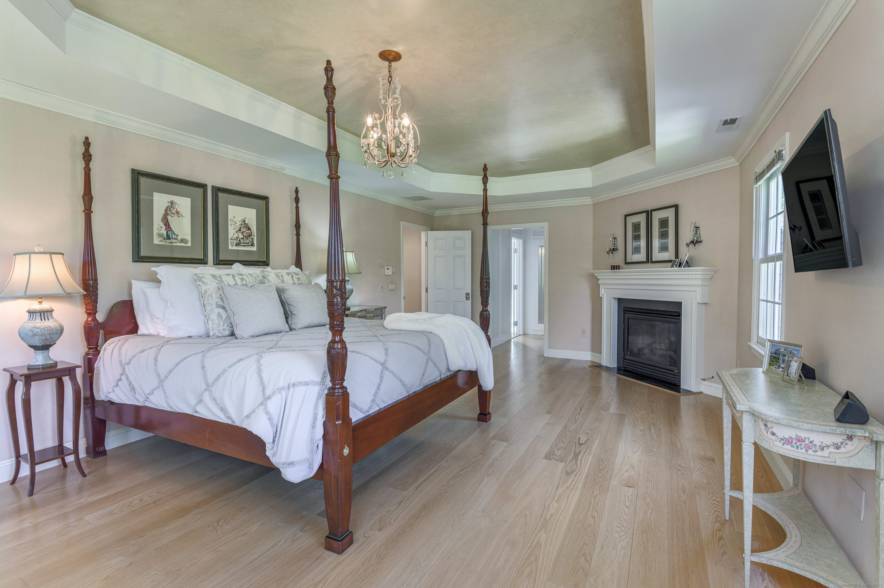 21 Schoolhouse Place Ridgefield, CT 06877 - Photo 19 of 40 a spacious bedroom with a bed and a flat screen tv