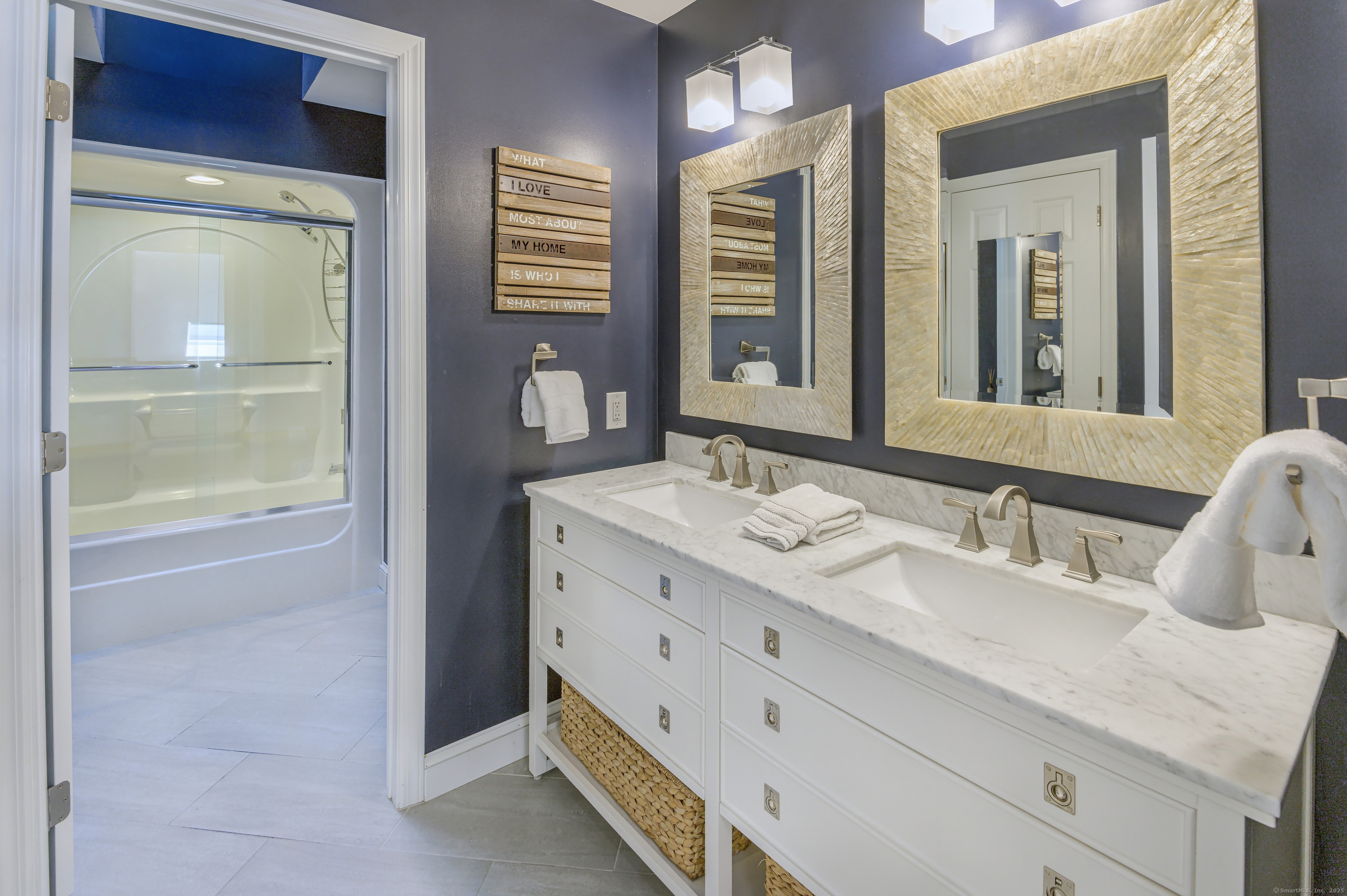 21 Schoolhouse Place Ridgefield, CT 06877 - Photo 25 of 40 a bathroom with a granite countertop sink and a mirror