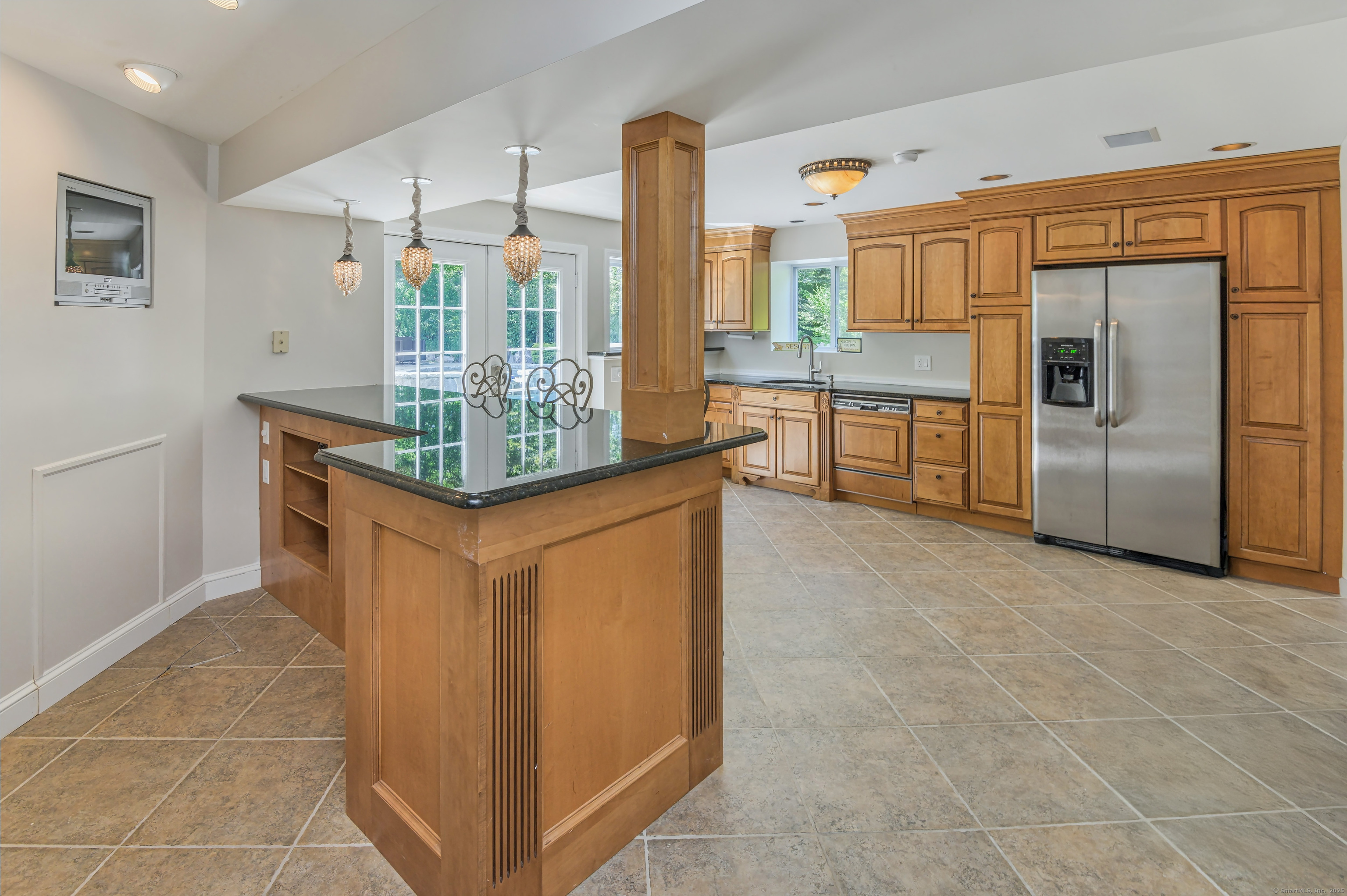 21 Schoolhouse Place Ridgefield, CT 06877 - Photo 30 of 40 a kitchen with stainless steel appliances granite countertop a refrigerator a sink and a stove