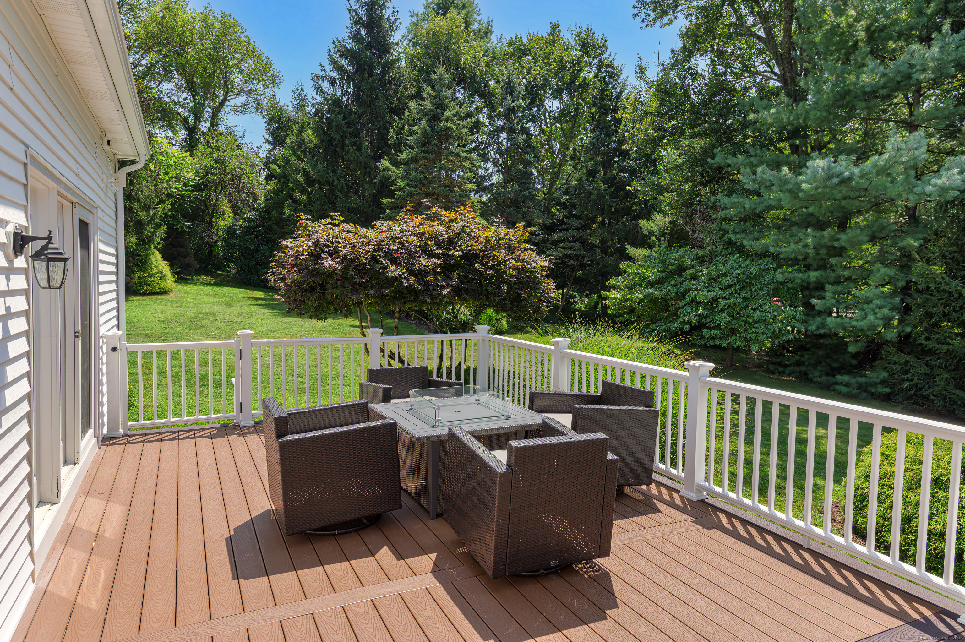 21 Schoolhouse Place Ridgefield, CT 06877 - Photo 32 of 40 a view of a deck with wooden floor and barbeque oven