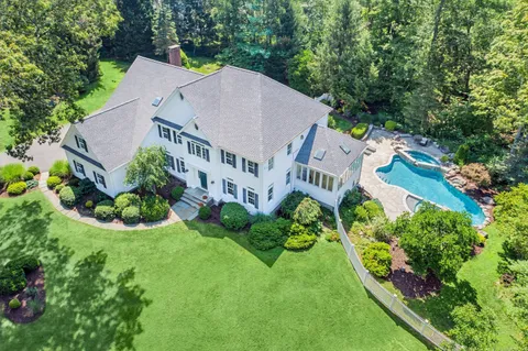 an aerial view of a house with garden
