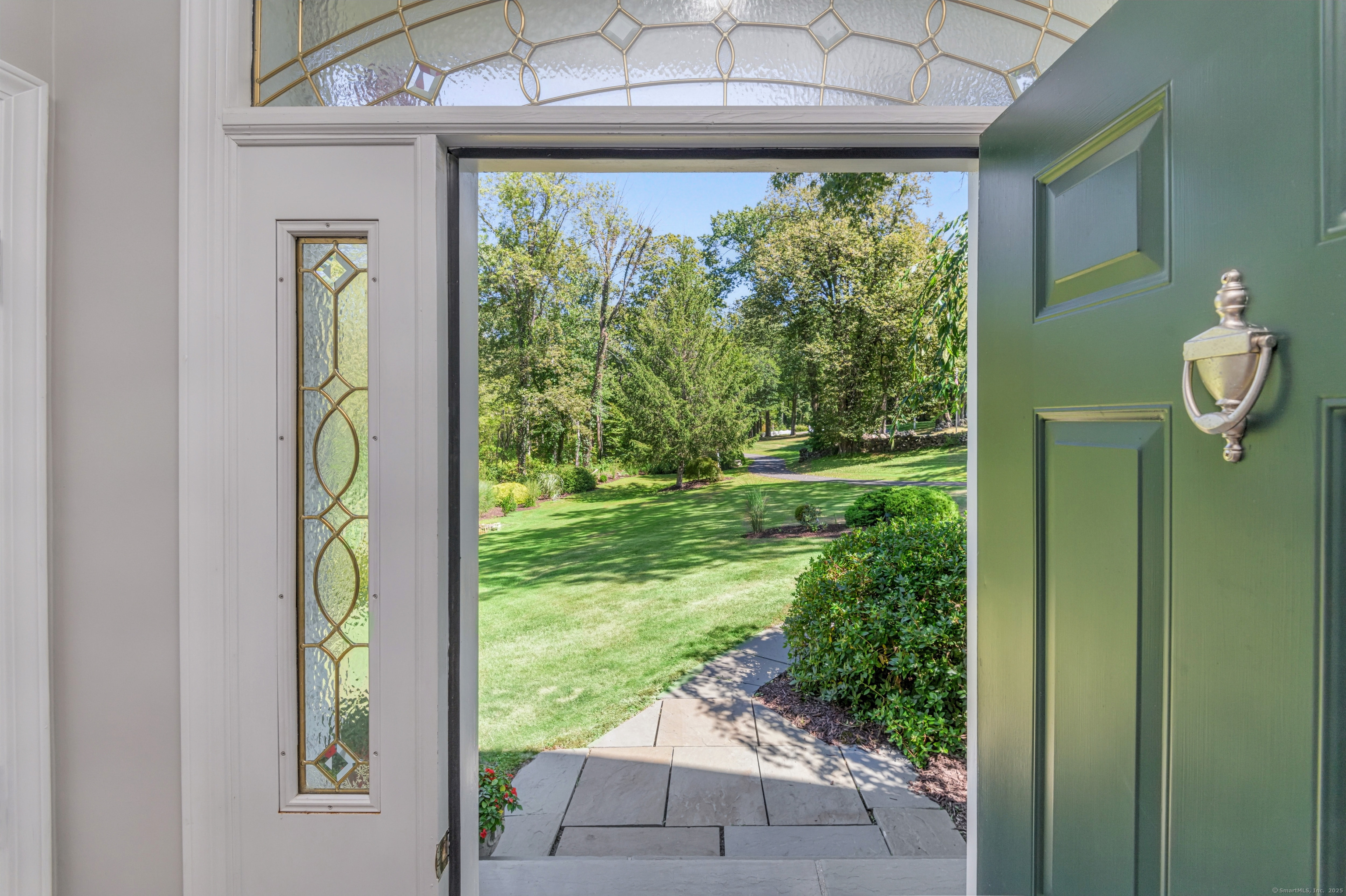 21 Schoolhouse Place Ridgefield, CT 06877 - Photo 6 of 40 a view of a garden from a window