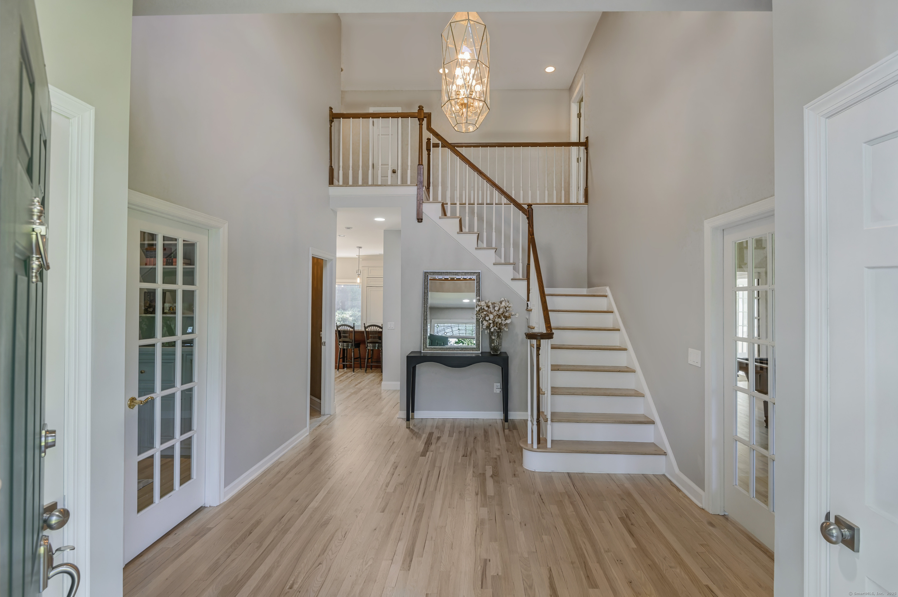 21 Schoolhouse Place Ridgefield, CT 06877 - Photo 7 of 40 a view of entryway and hall with wooden floor