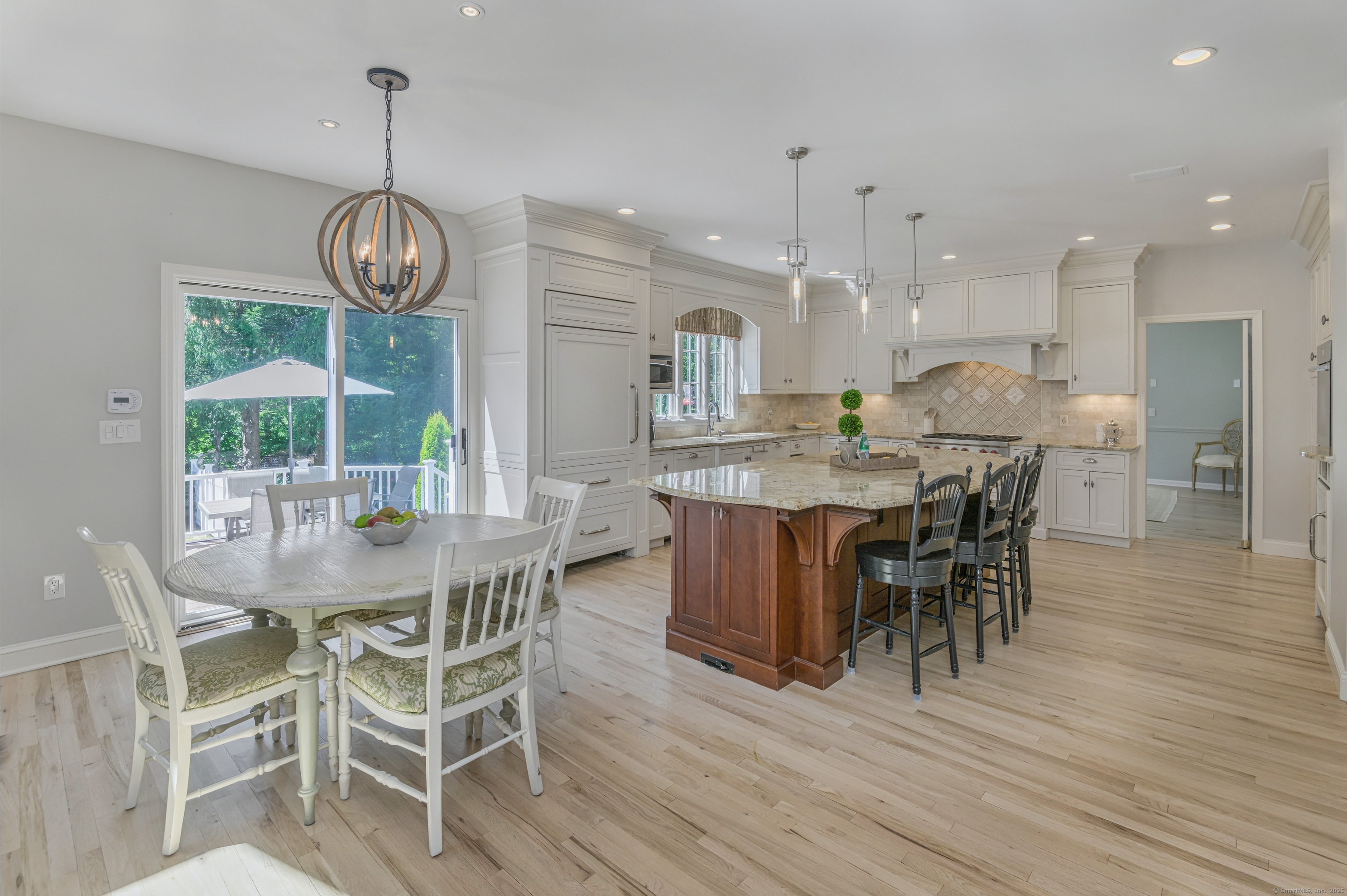 21 Schoolhouse Place Ridgefield, CT 06877 - Photo 10 of 40 a view of a dining room with furniture wooden floor and chandelier