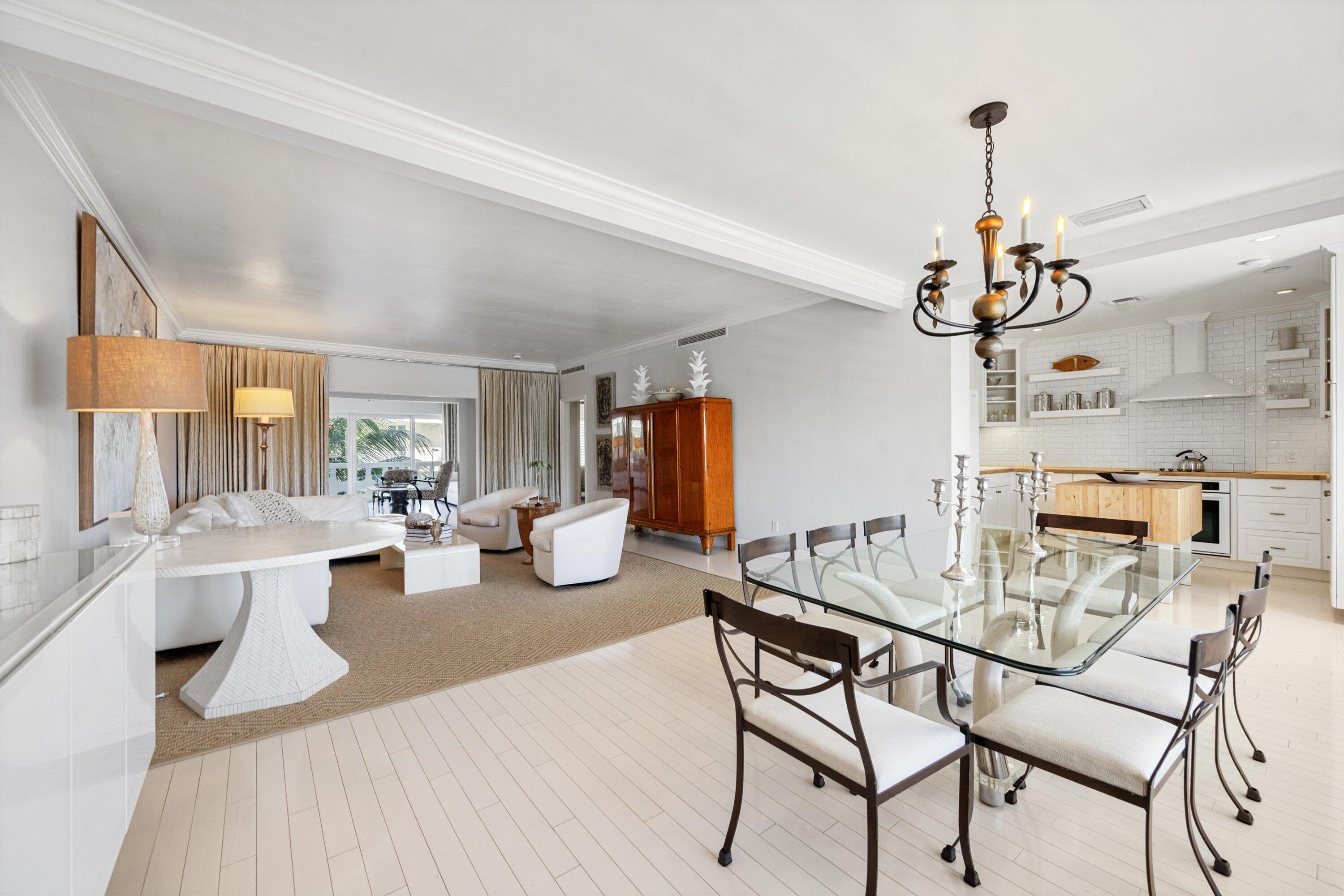 300 South Ocean Boulevard, Unit 4F Palm Beach, FL 33480 - Photo 1 of 19 a view of a dining room with furniture window and wooden floor