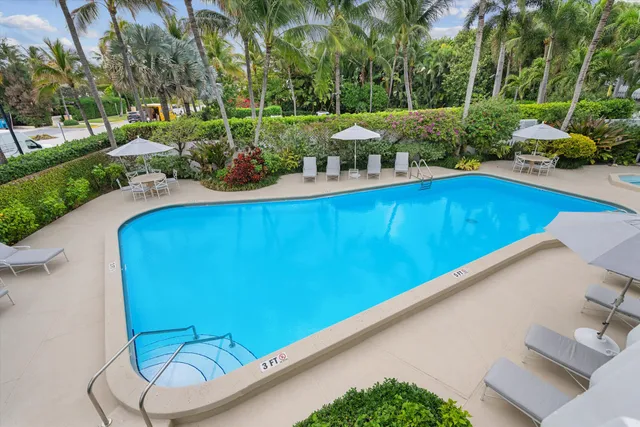 a view of a swimming pool with a patio