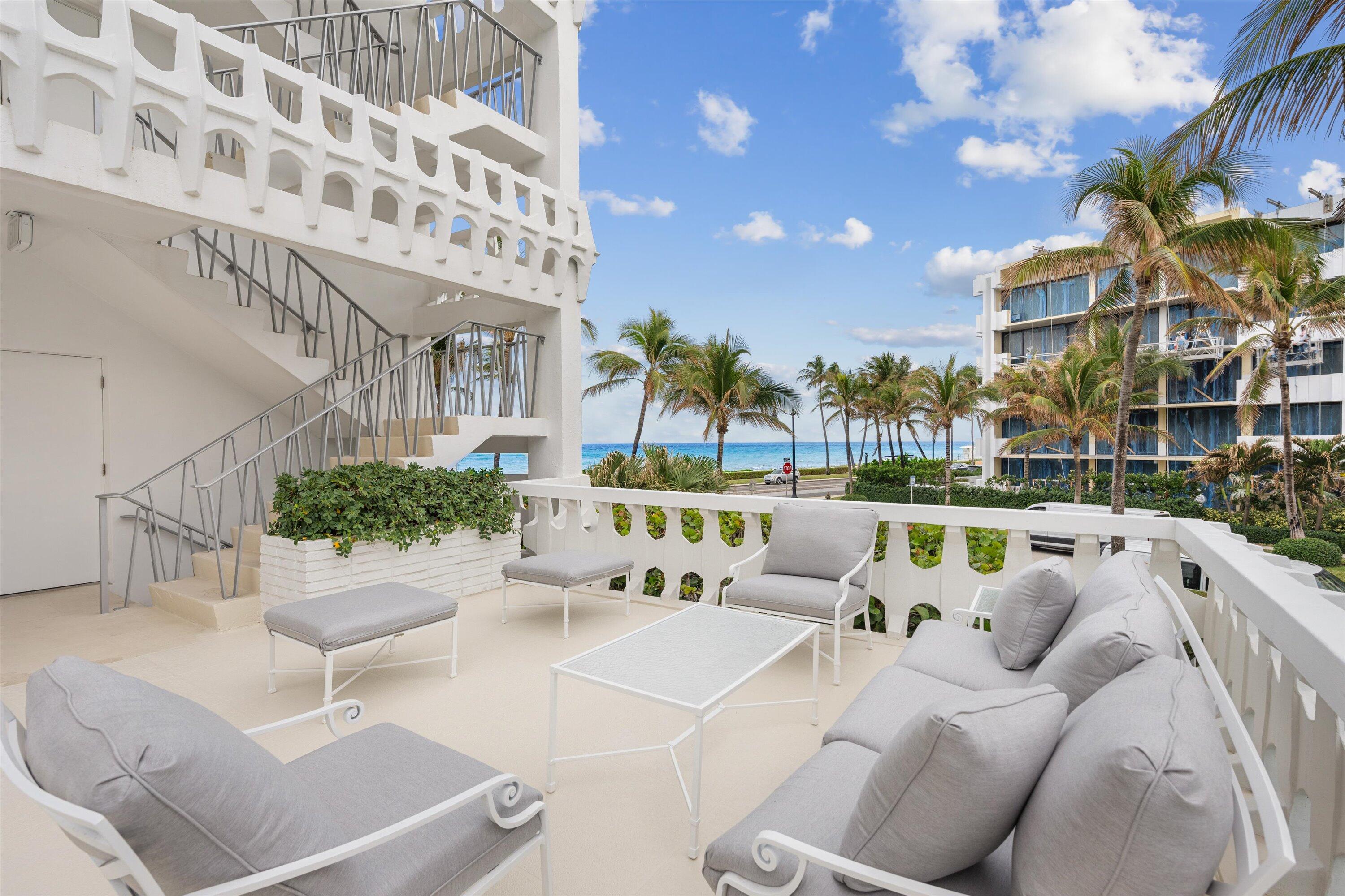 300 South Ocean Boulevard, Unit 4F Palm Beach, FL 33480 - Photo 19 of 19 a view of a patio with couches and a fire pit
