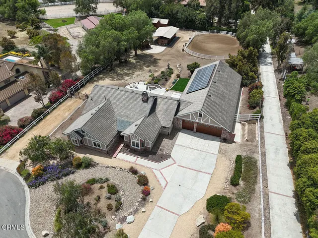 an aerial view of a house with outdoor space