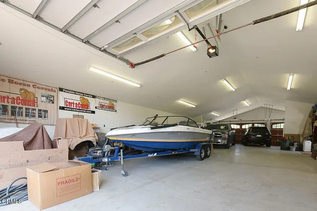 a car and bed sitting in a room