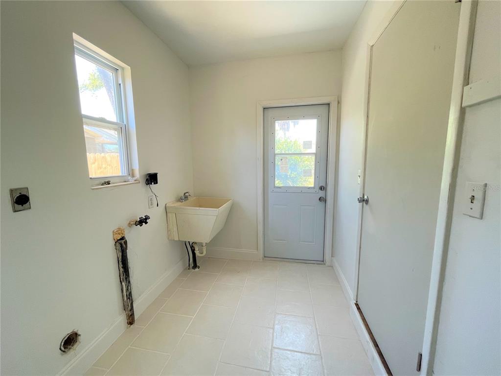 9 Jeff Road Largo, FL 33774 - Photo 11 of 23 a bathroom with a sink and a toilet