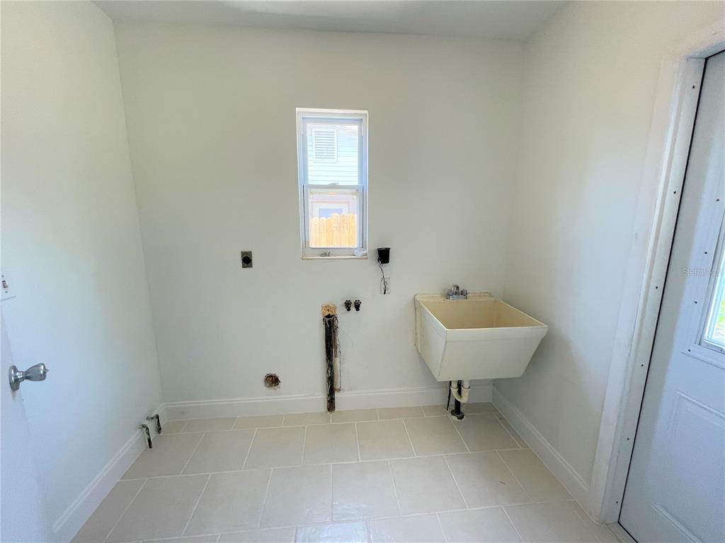9 Jeff Road Largo, FL 33774 - Photo 12 of 23 a bathroom with a sink and a toilet