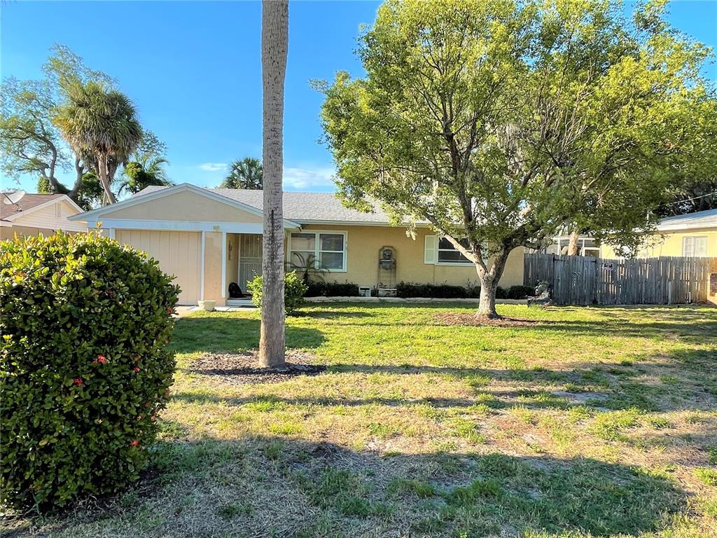 9 Jeff Road Largo, FL 33774 - Photo 2 of 23 a house view with swimming pool in front of it
