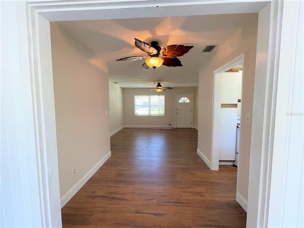 9 Jeff Road Largo, FL 33774 - Photo 5 of 23 a view of entryway with wooden floor