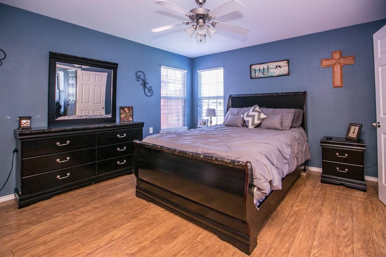 2204 100th Street Lubbock, TX 79423 - Photo 7 of 10 a bedroom with a bed and a dresser