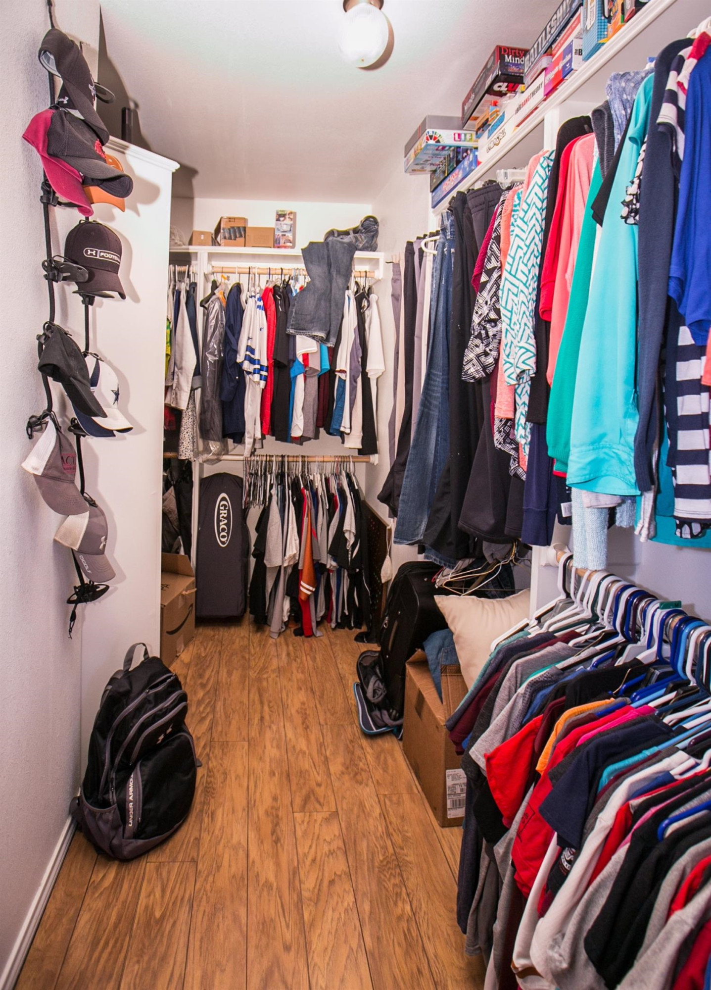 2204 100th Street Lubbock, TX 79423 - Photo 9 of 10 a view of walk in closet with clothes and shoes
