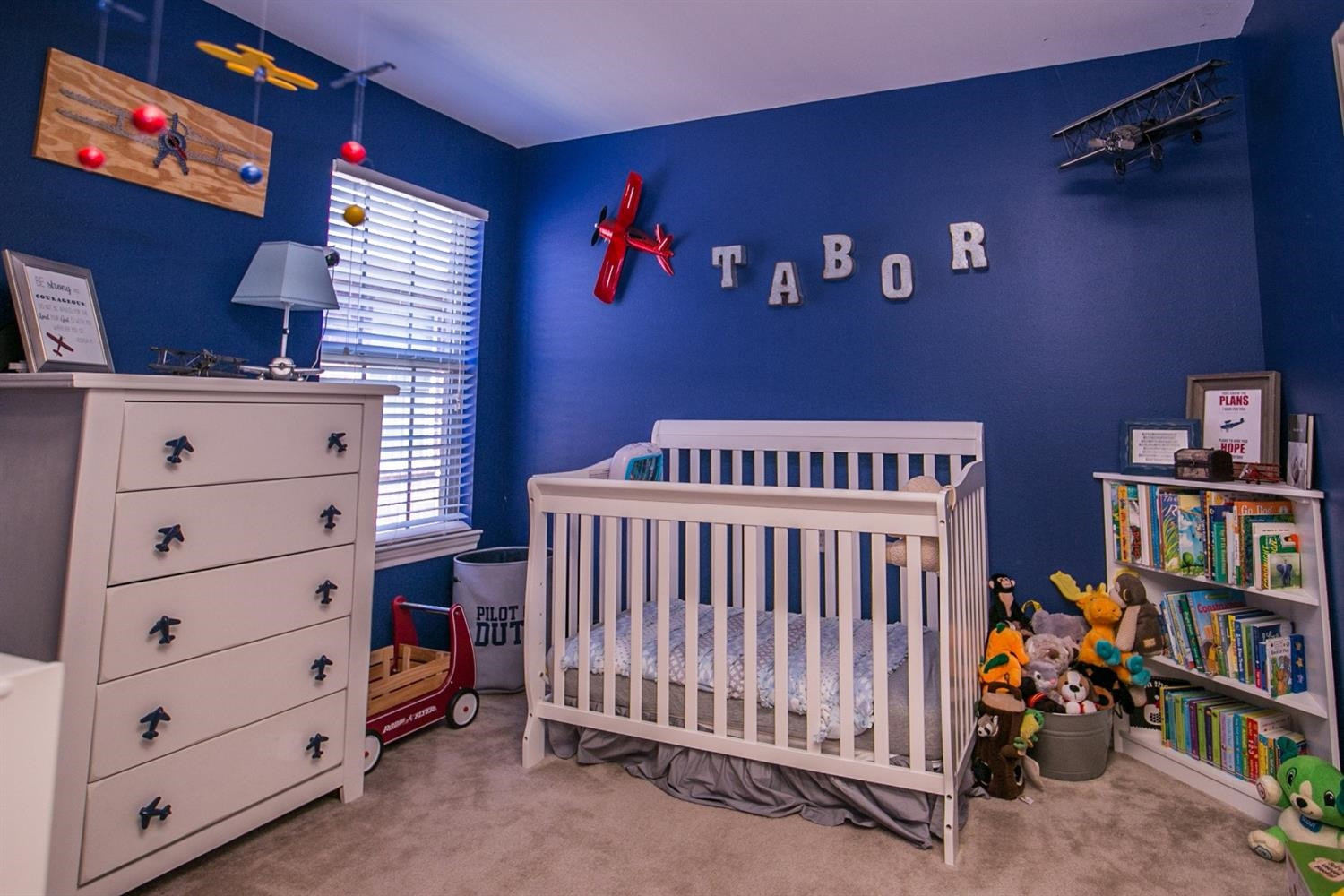 2204 100th Street Lubbock, TX 79423 - Photo 10 of 10 a bed room with a bed and a book shelf
