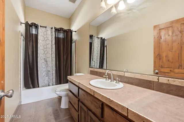 a utility room with a sink washer and dryer