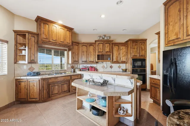 a kitchen with a stove and a refrigerator
