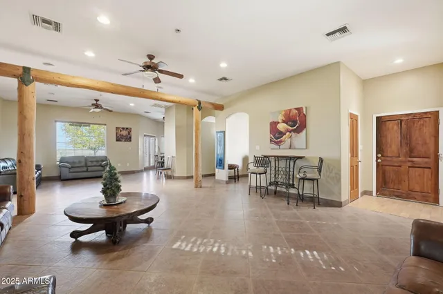 a view of a livingroom with furniture and a flat screen tv