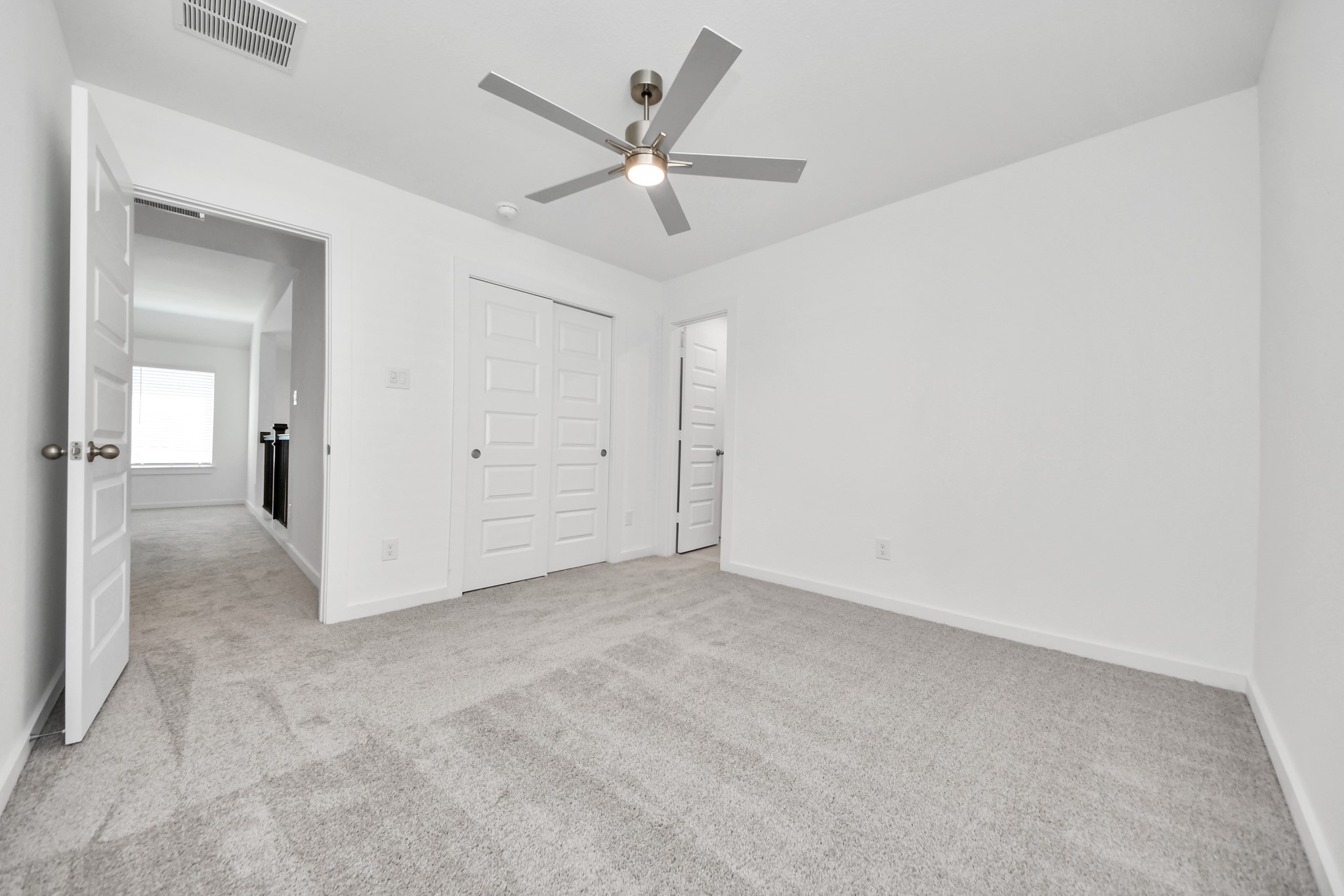 2926 Bury Park Dr Spring Spring, TX 77373 - Photo 28 of 40 Generously sized secondary bedrooms featuring spacious closets, soft and inviting carpeting underfoot, large windows allowing plenty of natural light, and the added touch of privacy blinds for your personal retreat.