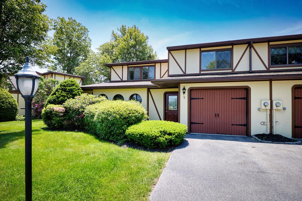 119 Stringham Road, Unit 7 LaGrangeville, NY 12540 - Photo 1 of 1 English style home with stucco siding, asphalt driveway, and a front yard