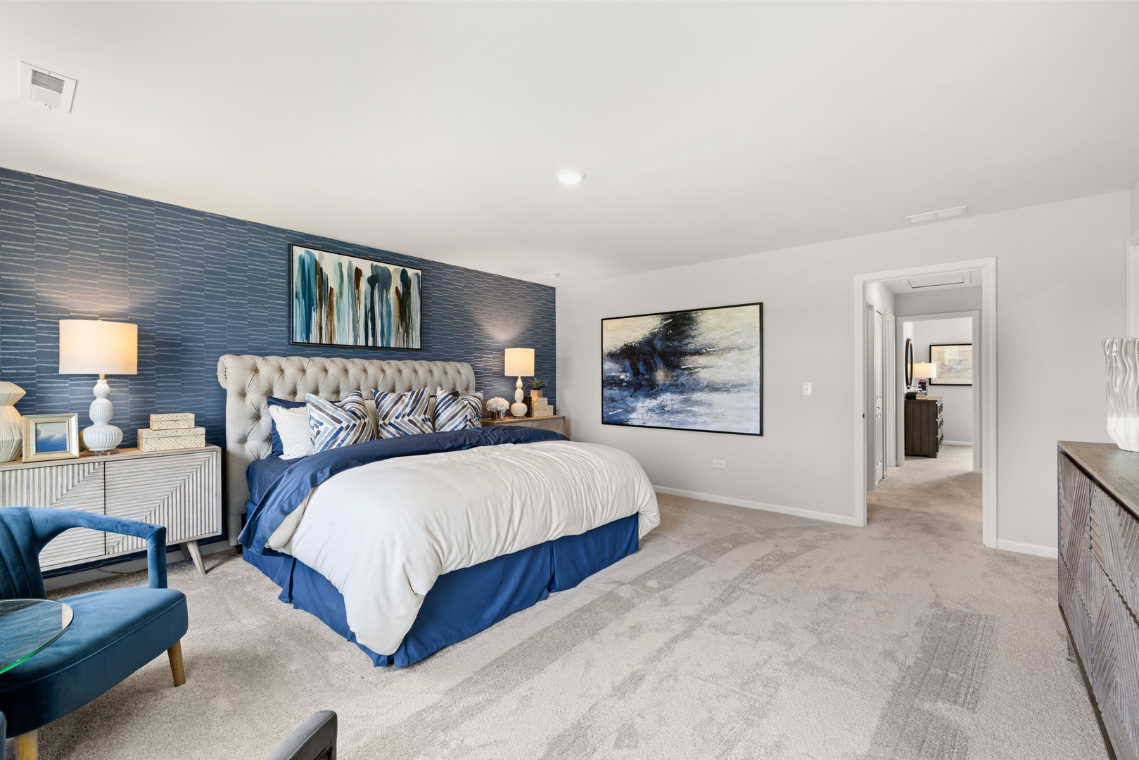 517 Wolverine Drive Aurora, IL 60502 - Photo 25 of 30 a spacious bedroom with a bed a couch and dresser