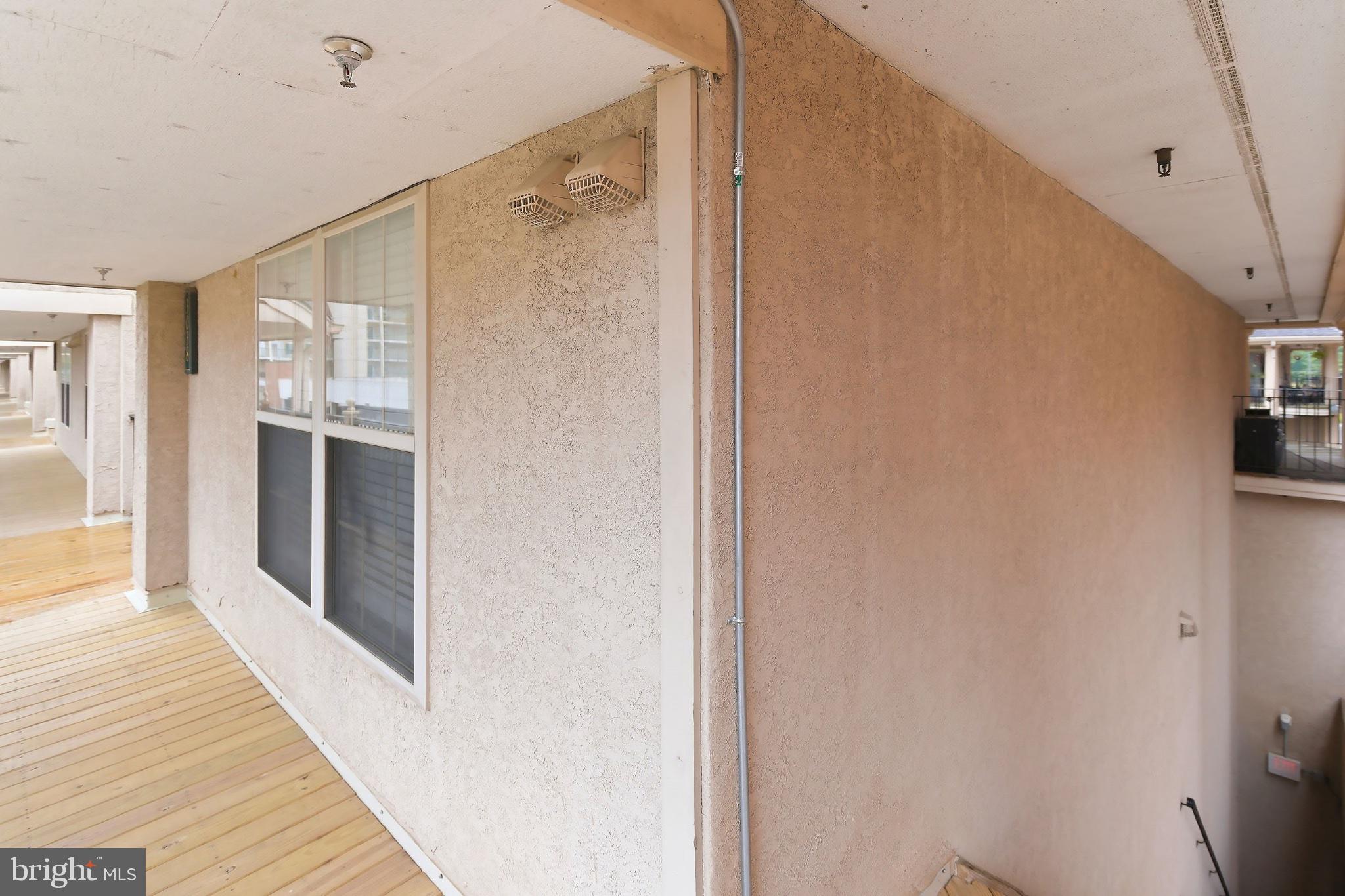 3036 Main Street, Unit 3036 Voorhees, NJ 08043 - Photo 24 of 24 Inviting corridor with natural light.