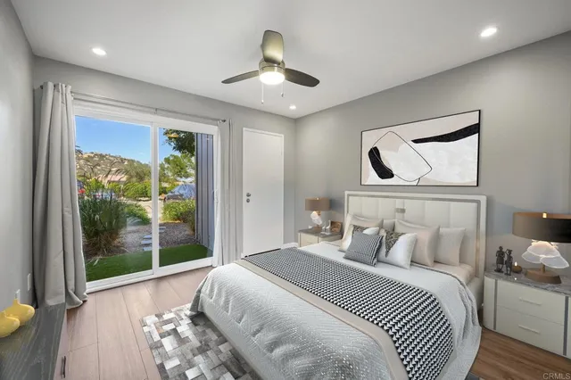a kitchen with kitchen island a sink stainless steel appliances and cabinets