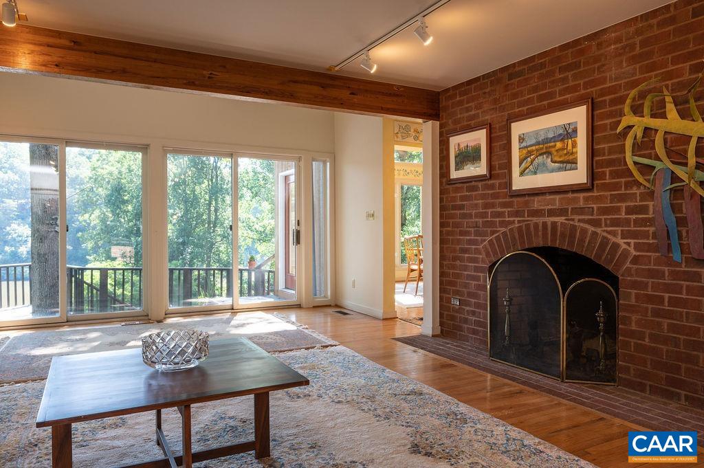 340 Cedar Bluff Road Charlottesville, VA 22901 - Photo 11 of 75 a living room with furniture and a fireplace