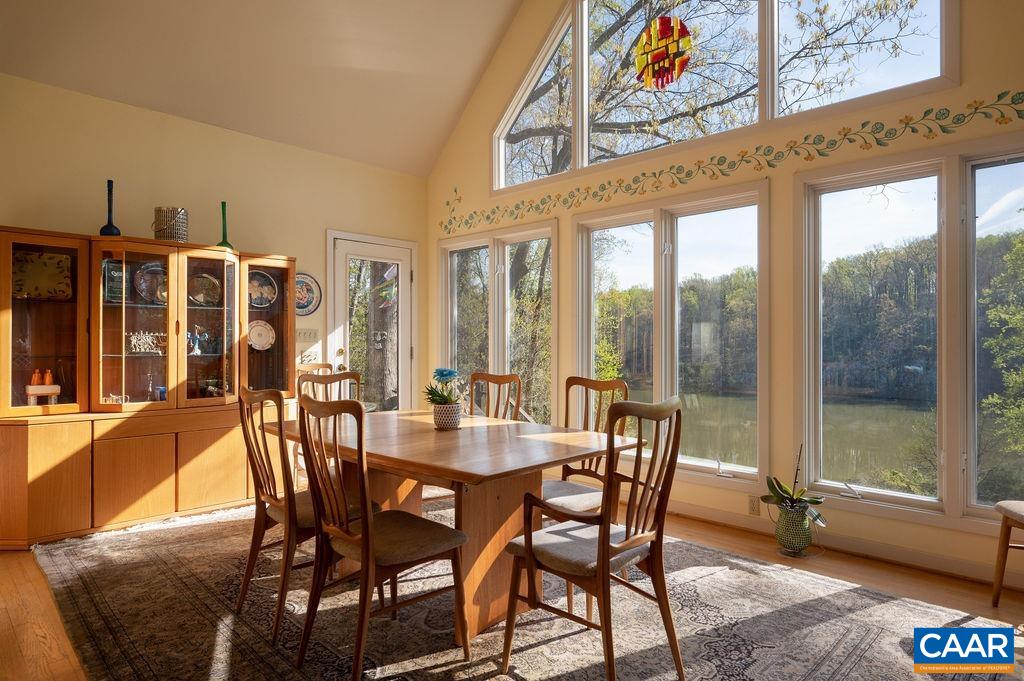 340 Cedar Bluff Road Charlottesville, VA 22901 - Photo 12 of 75 a view of a dining room with furniture large windows and wooden floor