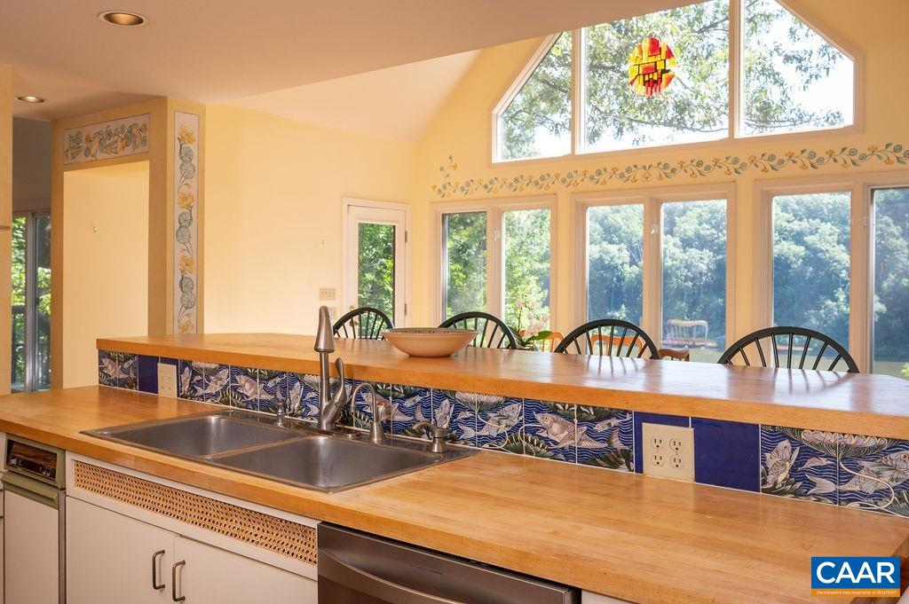 340 Cedar Bluff Road Charlottesville, VA 22901 - Photo 17 of 75 a view of a kitchen with granite countertop a sink and a wooden floor