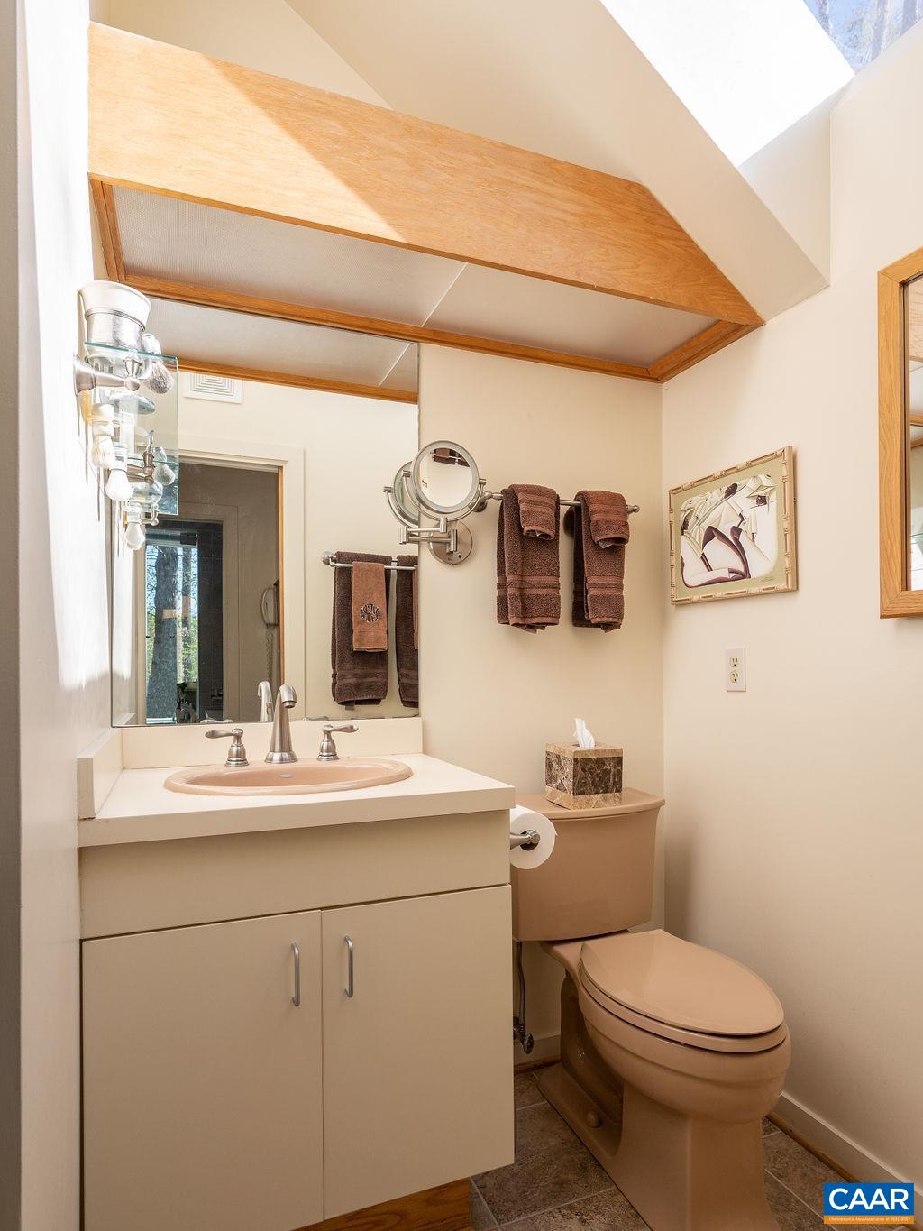 340 Cedar Bluff Road Charlottesville, VA 22901 - Photo 29 of 75 a bathroom with a toilet sink and mirror