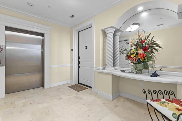 a view of living room kitchen and entryway