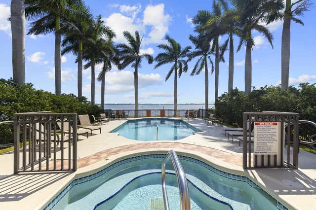 a view of a swimming pool with a table and chairs