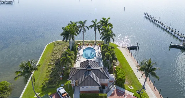 a vase of flowers sitting on a floor