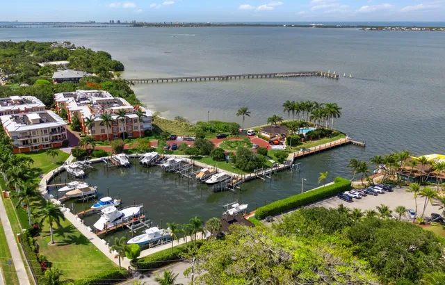 an aerial view of a house with a lake view