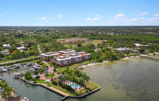 an aerial view of a house with a lake view