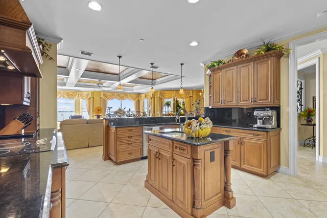 a kitchen with a stove top oven sink and cabinets