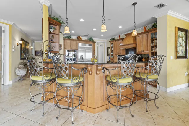 a view of a dining room with furniture and a chandelier
